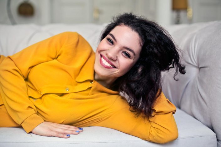 woman-smiling-yellow