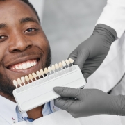 man-smiling-while-female-dentist-keeping-range-fillings