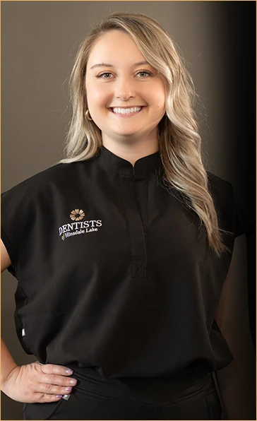 Professional headshot of Dorothy, a dedicated dental hygienist at Dentists of Hinsdale Lake, smiling engagingly in her black clinic attire, showcasing her commitment to patient care and oral health education.